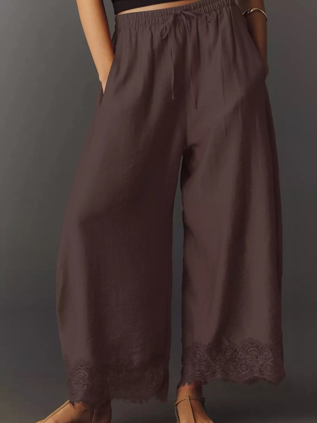 Chocolate wide leg pants showing the tie waist and flowing legs