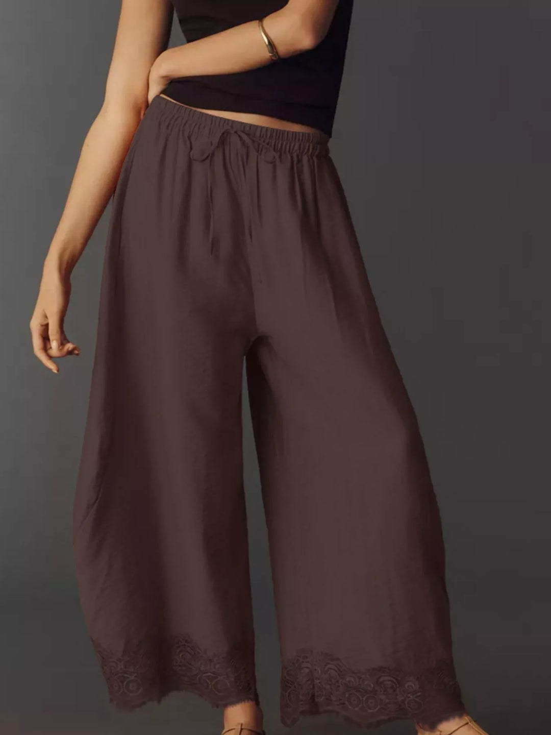 Chocolate drawstring pants from a three quarter angle with lace trim