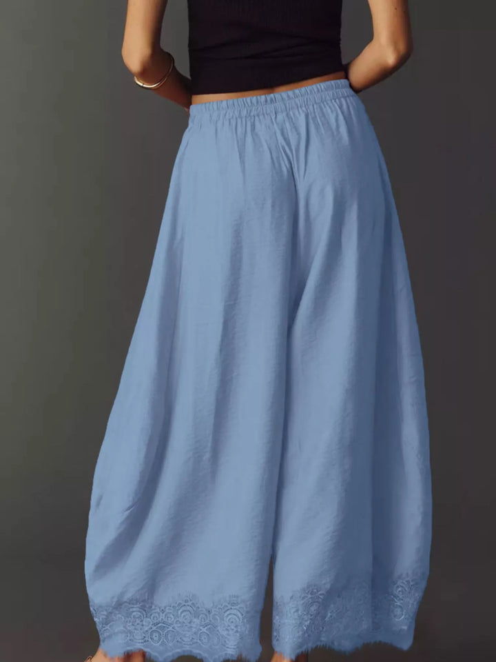 Back view of the light blue wide leg pants with elastic waist