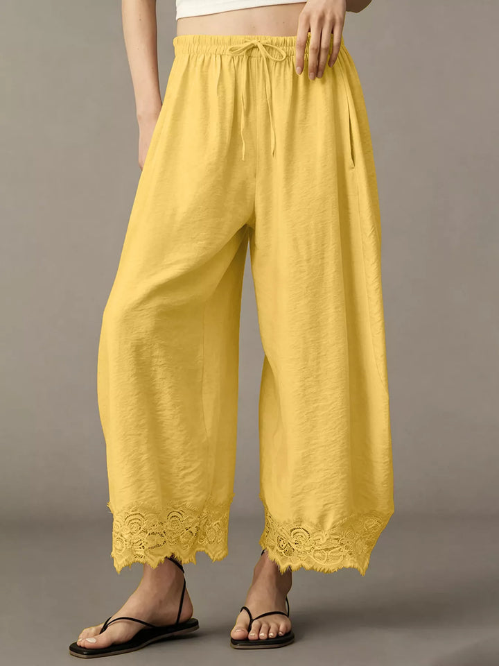 Back view of the yellow wide leg pants with gathered waist