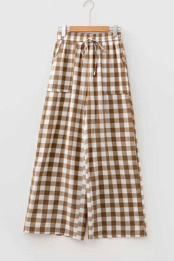 Brown gingham plaid wide leg pants hanging, front view with drawstring