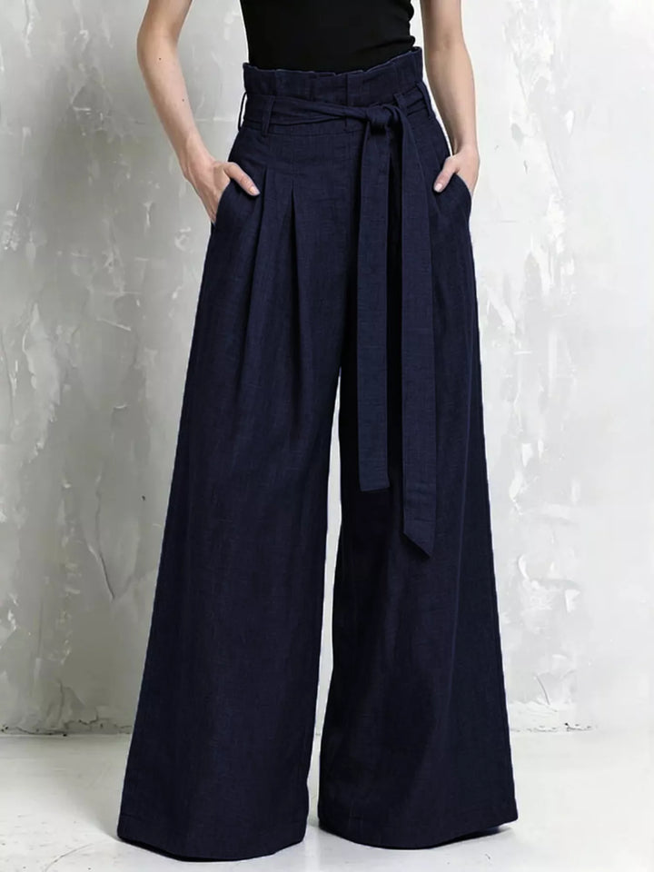 Navy high waist wide leg pants with belt tied at the paperbag waist