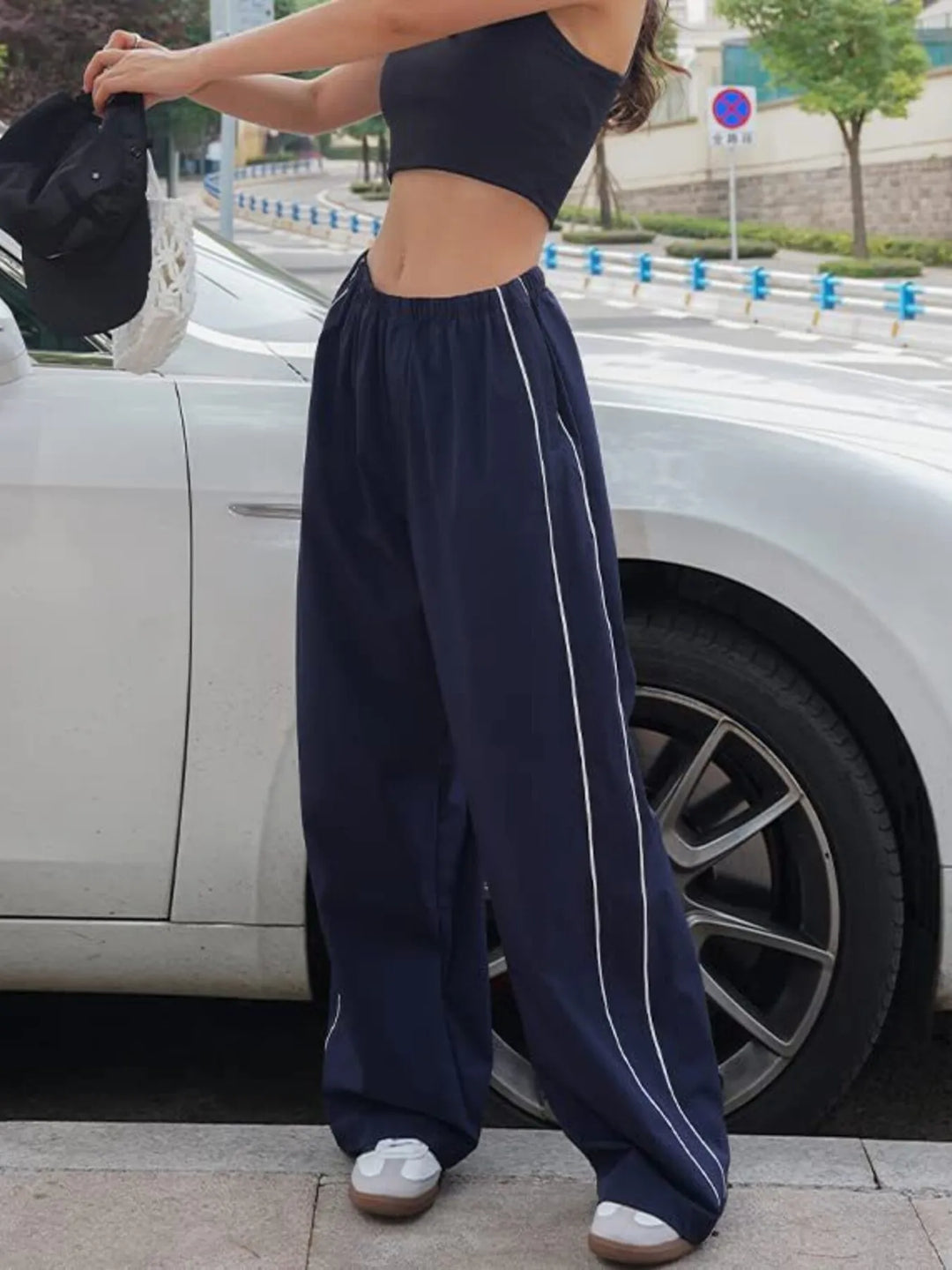 Parachute elastic drawstring side piping in black, front view