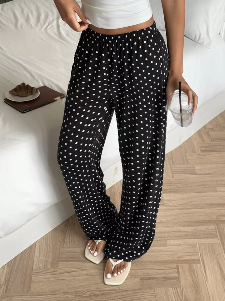 Women's wide leg pants in black polka dot with an elastic waist, front view