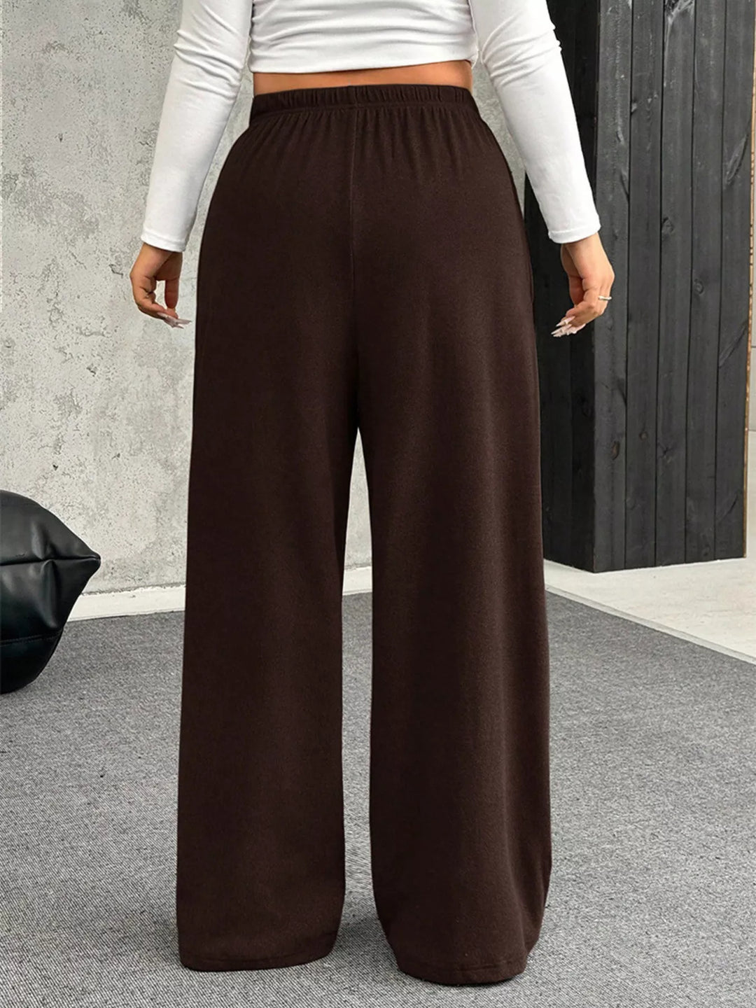 Back view of the brown ribbed wide leg pants with elastic waist