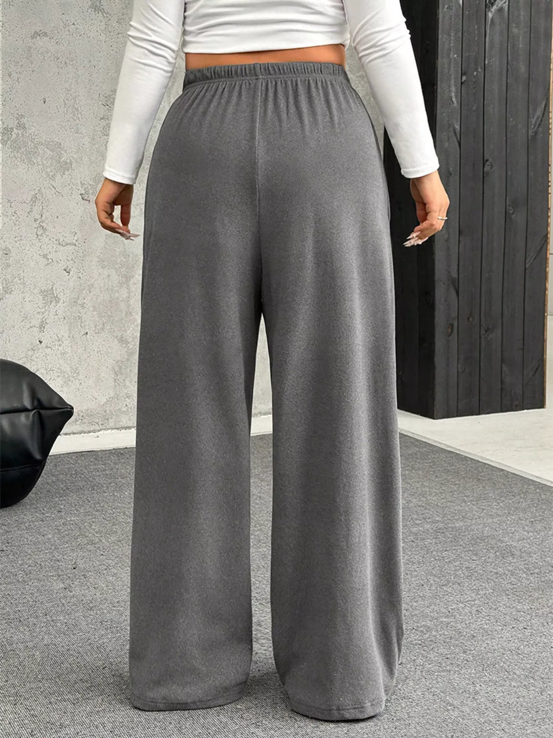 Back view of the gray ribbed wide leg pants