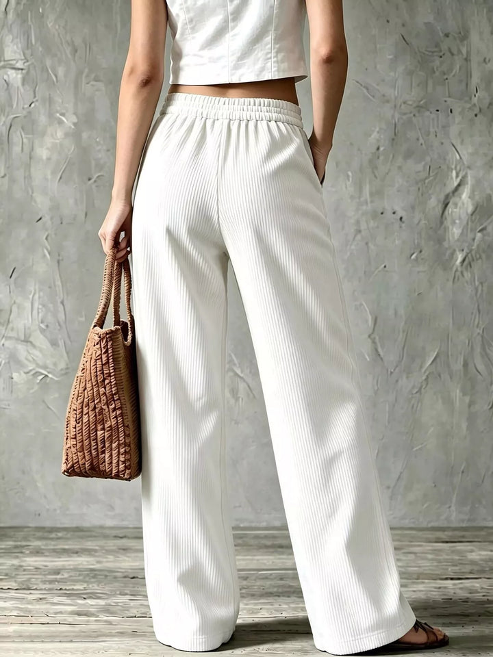 Back view of the white wide leg pants with elastic back waist