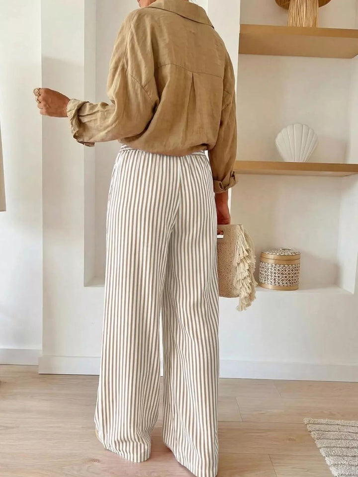 Back view of beige striped wide leg pants with tan top