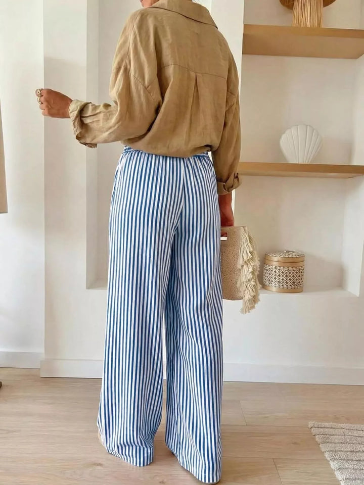 Back view of blue striped flowy wide leg pants