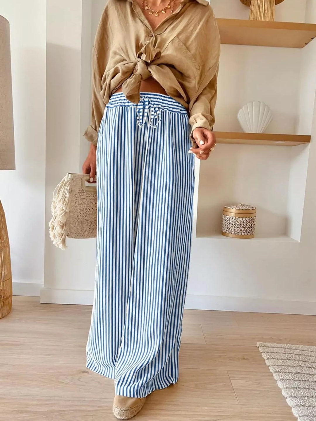 Blue thin stripe wide leg pants with drawstring waist and tied tan top