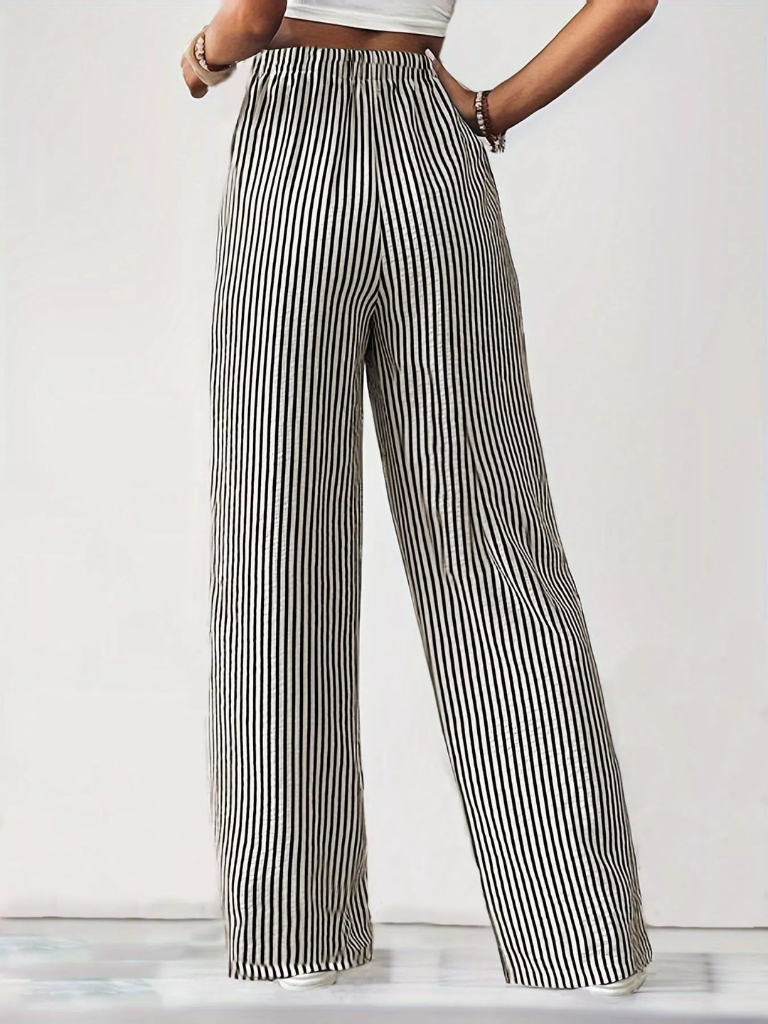 Full length gray striped wide leg pants with a white crop top