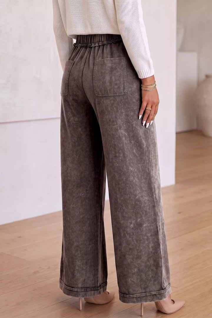 Coffee brown drawstring wide leg pants from behind, full length with heels
