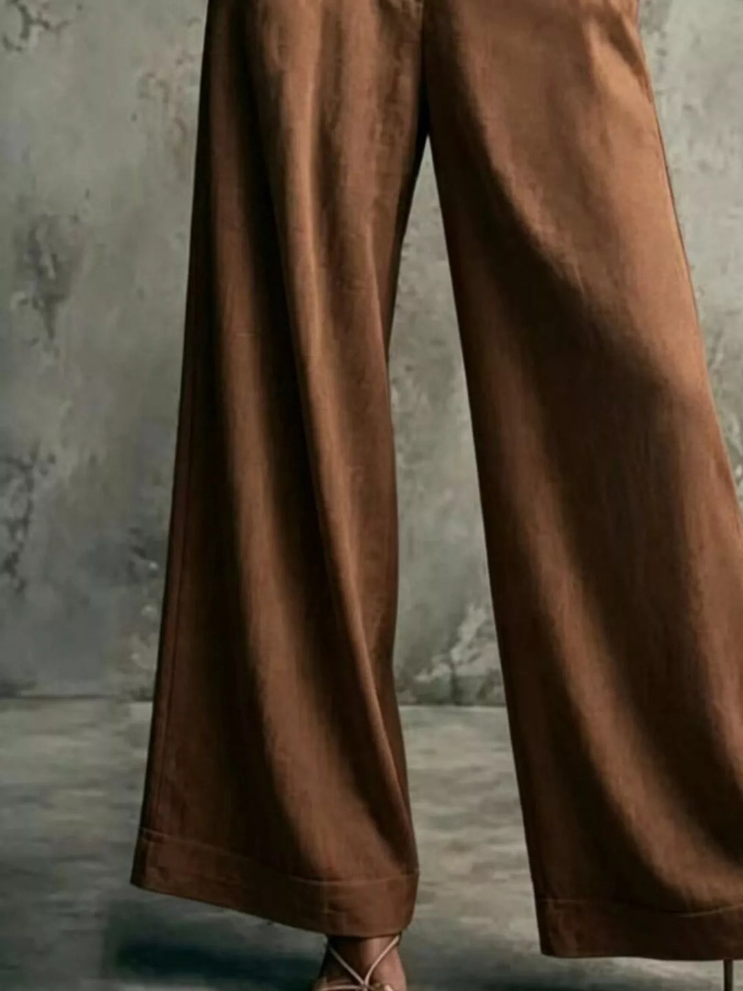 Brown wide leg trousers, close-up of the flowing leg and hem