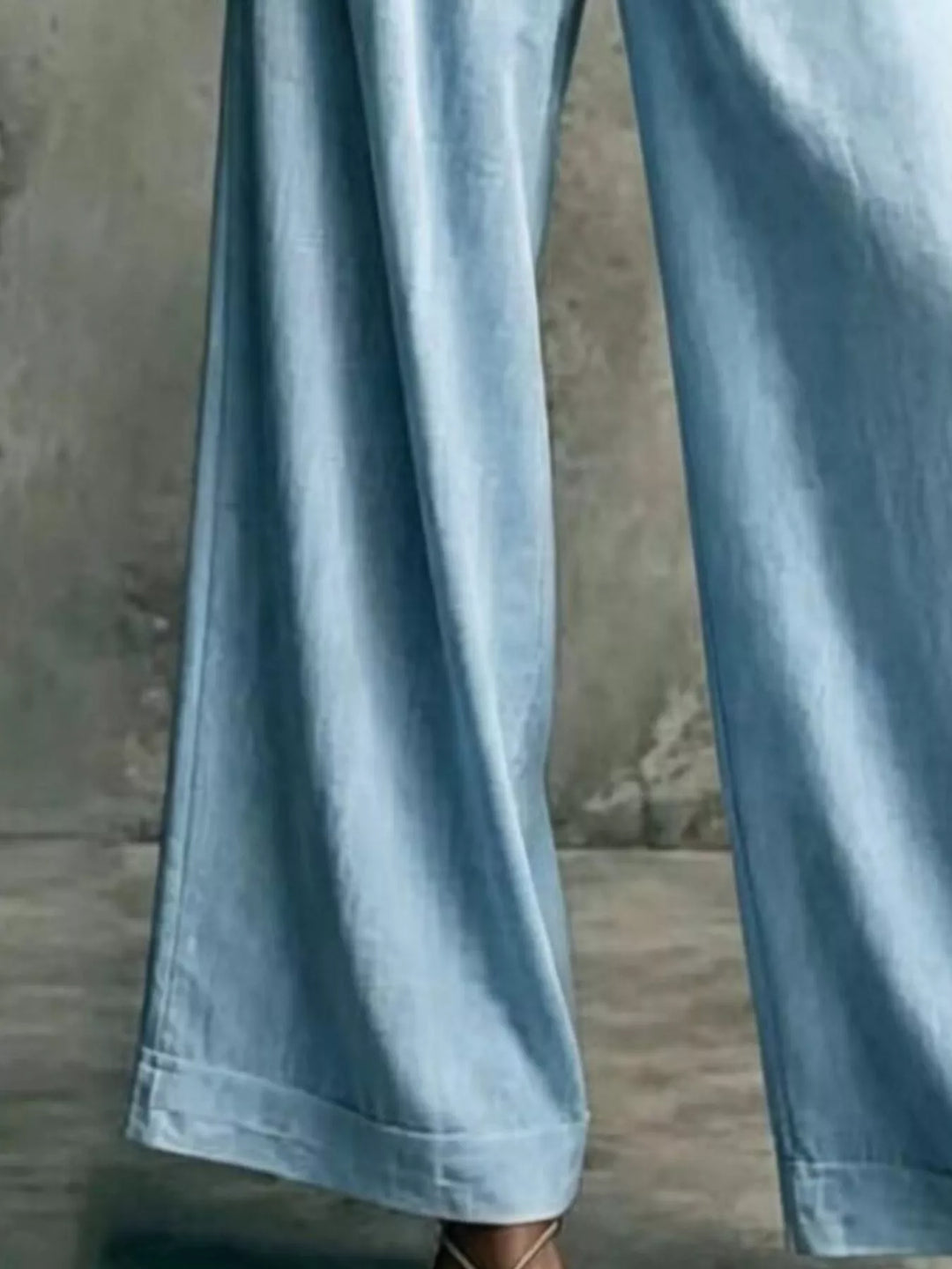 Light blue wide leg trousers, close-up of the hem and flowing leg