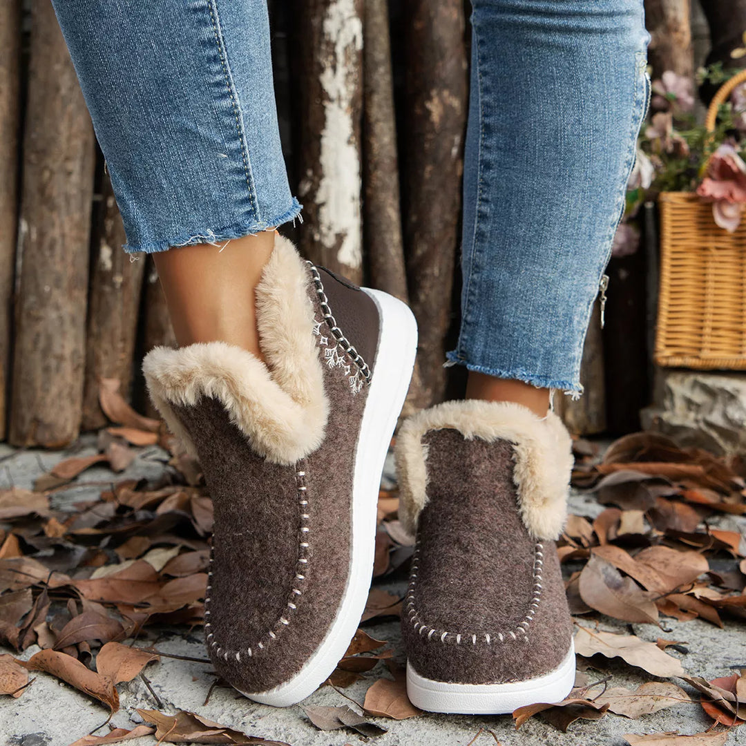 Coffee brown slip on ankle boots with plush collar worn with jeans