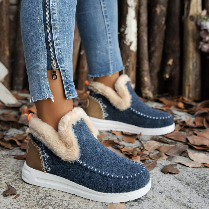 Denim blue plush collar boots, front view with cuffed jeans