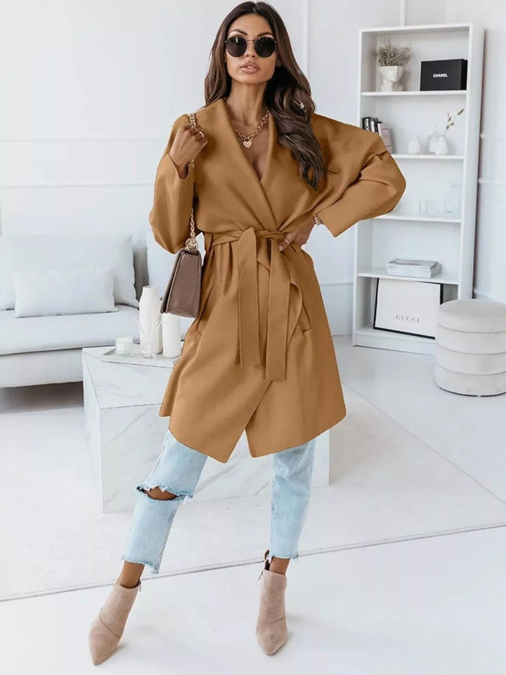 Full length look with camel belted coat, light jeans and nude ankle boots