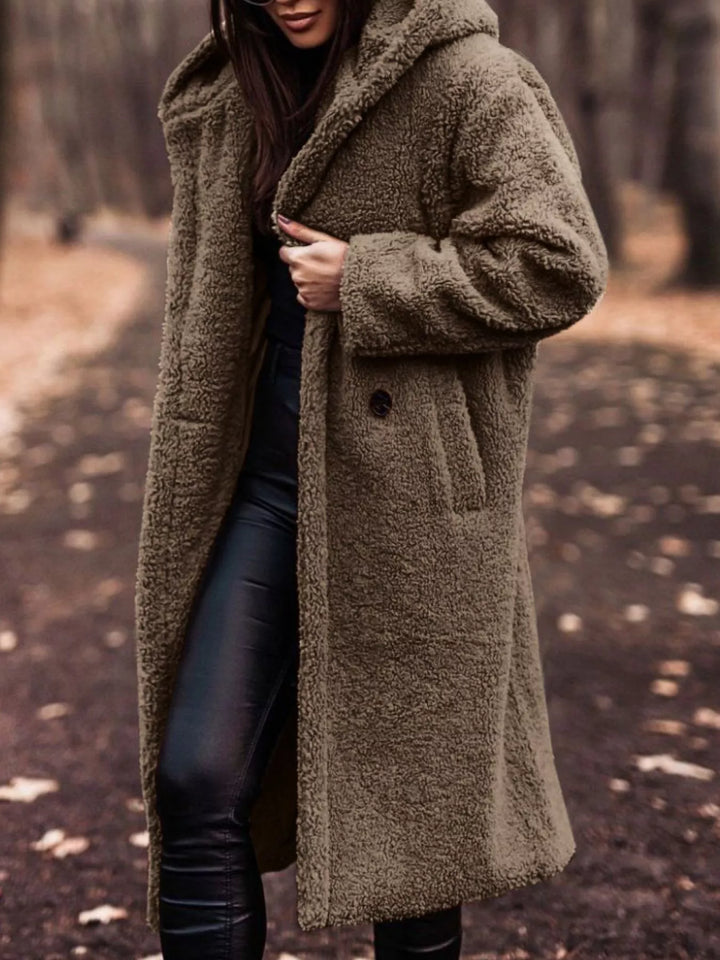 Khaki longline open front coat showing the pocket and skirt length