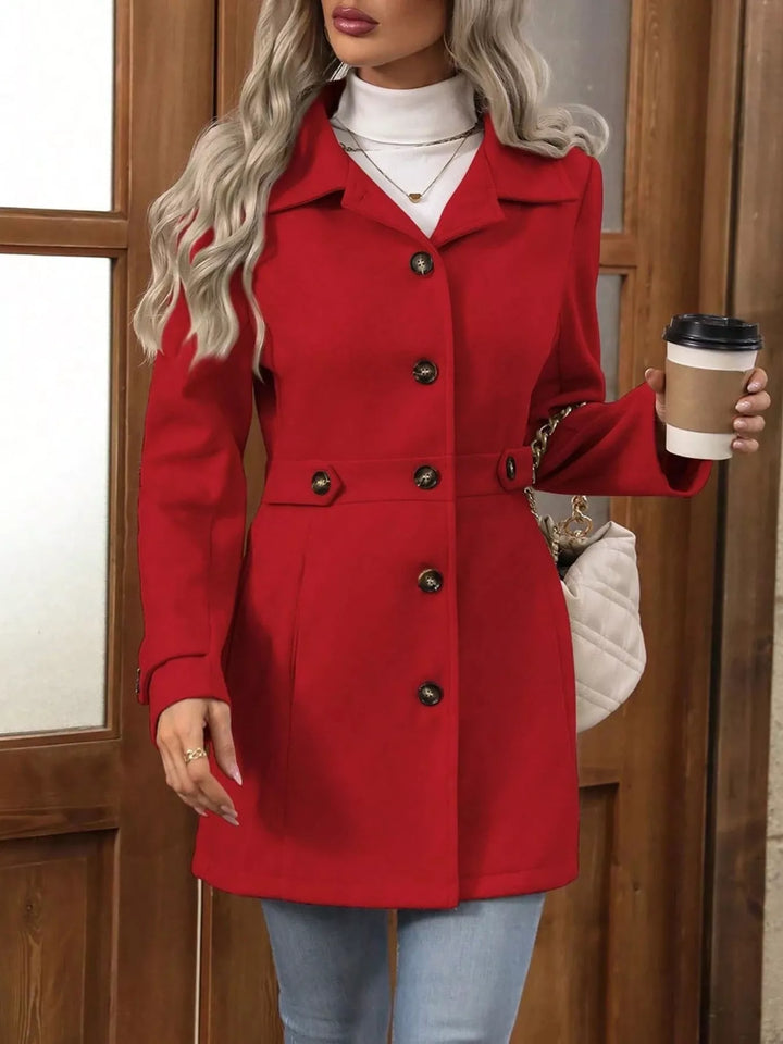 Red belted waist coat buttoned at the front with a coffee cup
