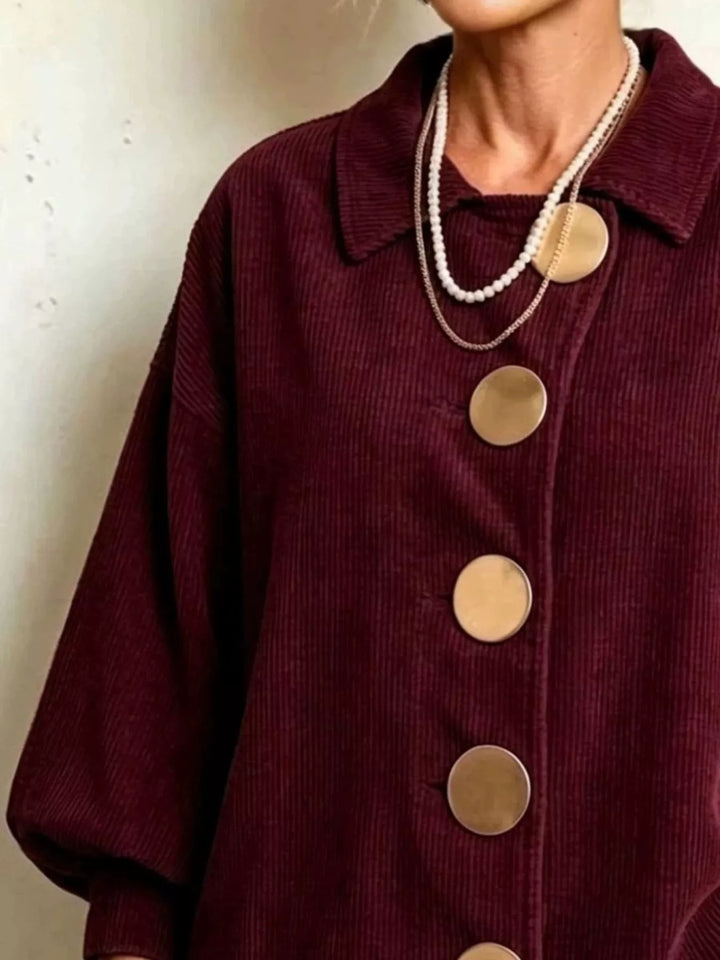 Corduroy-look scalloped hem round buttons in burgundy, close-up detail