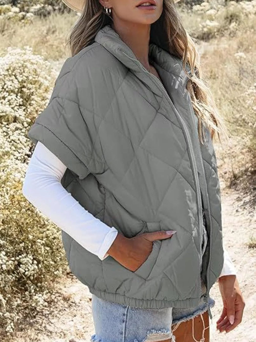 Diamond quilted short sleeve zip in grey, styled on model