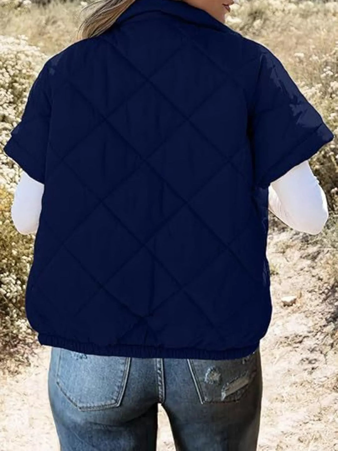 Diamond quilted short sleeve zip in navy blue, back view